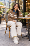Woman wearing beige denim collar striped sweater by Purple Imli in a city street look