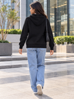 Black knit zip-up women's hoodie by Purple Imli – back view