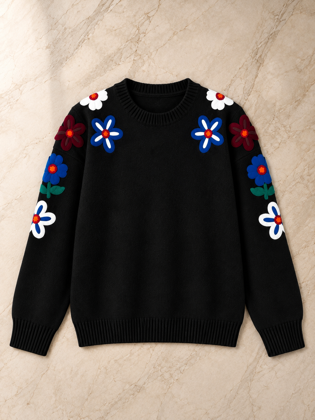 Close-up of embroidery on black women's winter sweater by Purple Imli