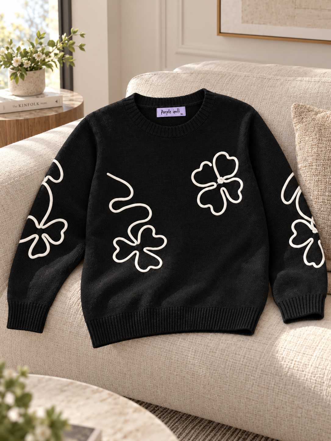 Close-up detail of black outline flower women's sweater by Purple Imli