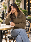 Woman wearing brown faux fur collar zip-up sweater by Purple Imli in a city street look