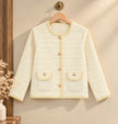 Close-up detail of cream pearl trim tweed women's cardigan jacket by Purple Imli