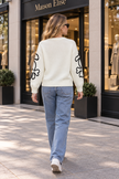 Cream outline flower women's sweater by Purple Imli – back view