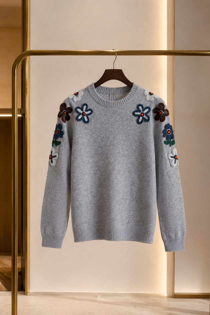 Close-up of embroidery on grey women's winter sweater by Purple Imli