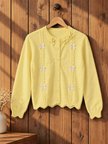Close-up detail of light yellow scalloped bow women's cardigan by Purple Imli