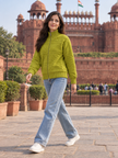 Woman wearing olive green textured knit zip-up sweater by Purple Imli in a city street look