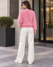 Pink fuzzy pearl flower women's cardigan by Purple Imli – back view