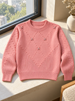 Close-up detail of pink bobble knit flower women's sweater by Purple Imli