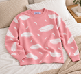 Close-up detail of pink feather print women's sweater by Purple Imli